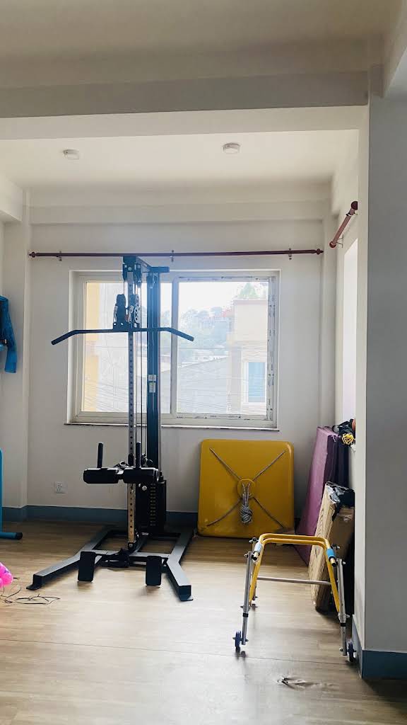 Strength and mobility equipment inside the Walk Nepal rehabilitation room